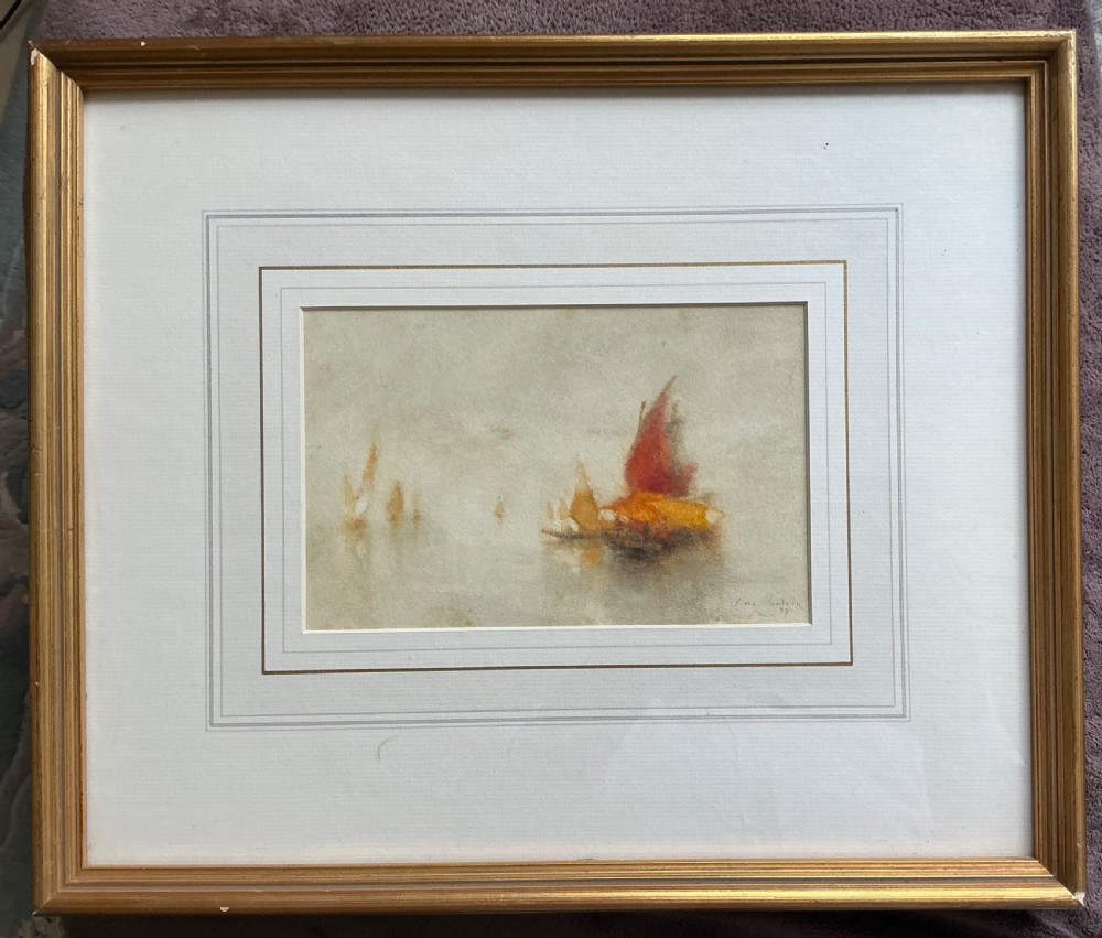 An atmospheric late 19th-century watercolour painting depicting Venetian sailing boats with reddish-brown and ochre sails on mist-covered water, signed Clara Montalba lower right. View II