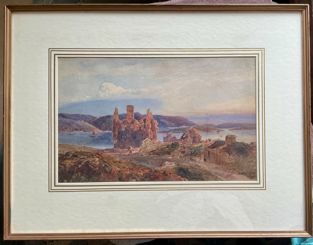 A 19th-century watercolour painting depicting a stone castle ruin on a rocky coast overlooking a bay with distant hills. View II