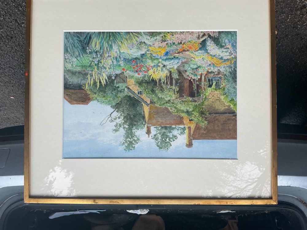 A watercolour painting depicting a traditional stone cottage with a chimney surrounded by a garden filled with colourful flowers, climbing vines, and trees. View III