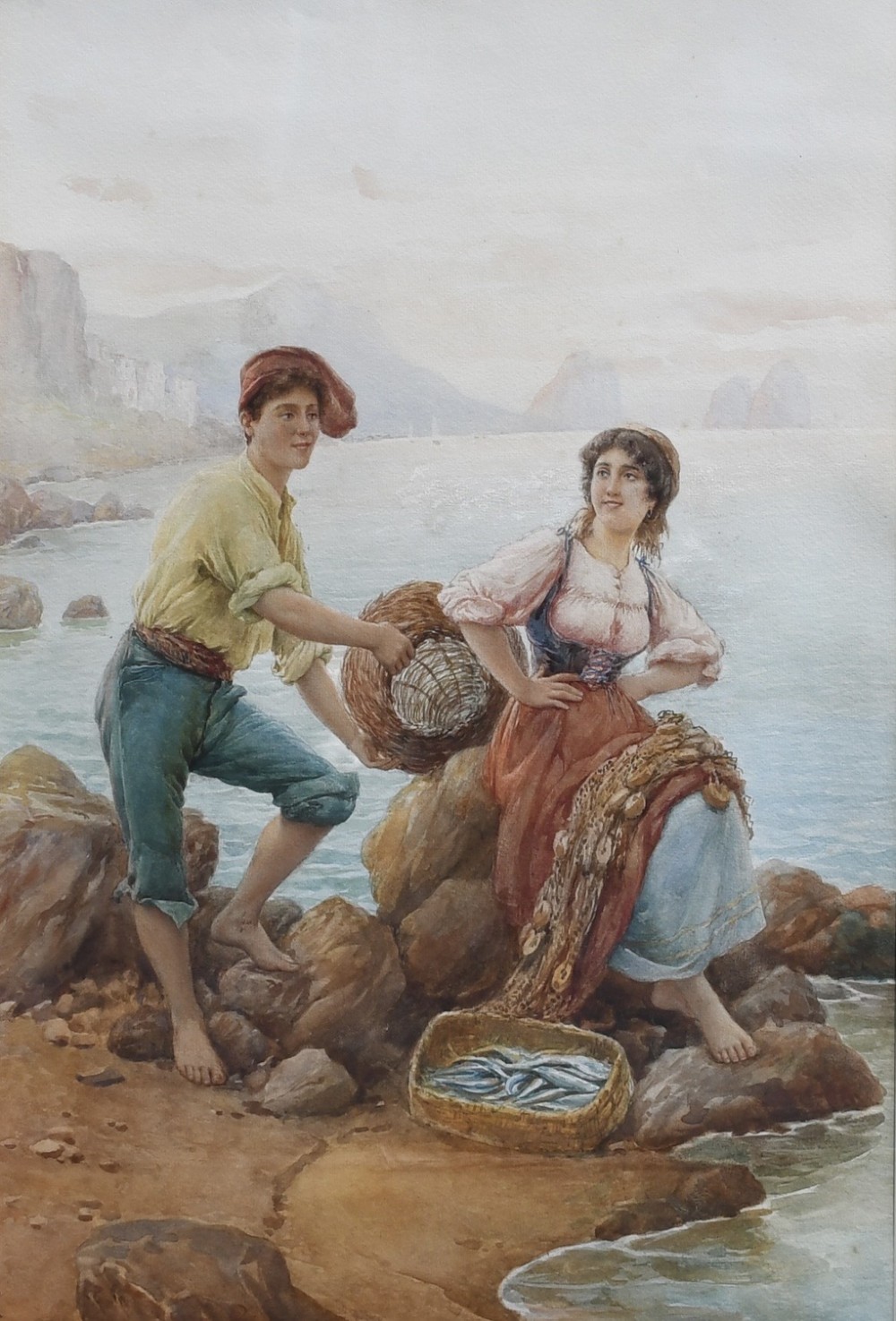 A nineteenth-century watercolour painting depicting a young man and woman in traditional attire resting on coastal rocks with woven baskets and fishing nets by the sea.