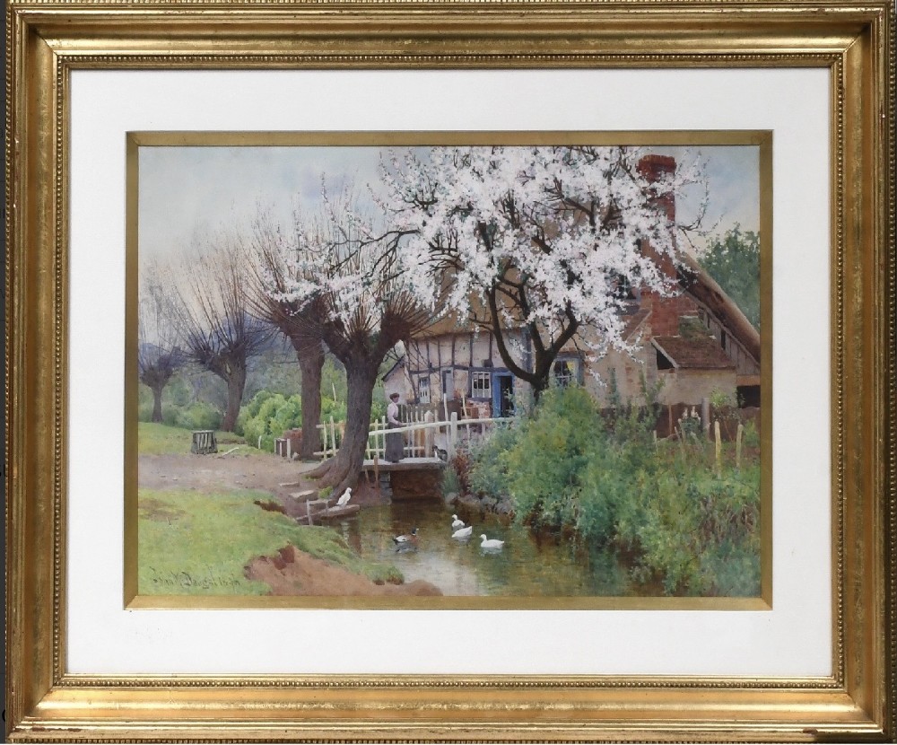 A framed watercolour painting by John McDougal depicting a thatched country cottage, a blossoming tree, and ducks in a stream within a beaded gilt frame.