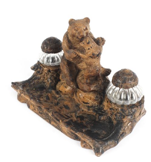 fig 2. A 19th-century carved wood Black Forest inkstand featuring a mother bear and cub sitting on a naturalistic log base between two clear glass inkwells.