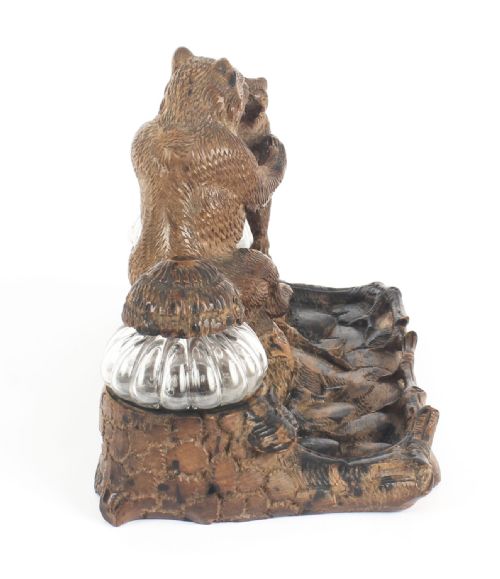 fig 3. A 19th-century carved wood Black Forest inkstand featuring a mother bear and cub sitting on a naturalistic log base between two clear glass inkwells.