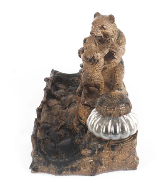 fig 4. A 19th-century carved wood Black Forest inkstand featuring a mother bear and cub sitting on a naturalistic log base between two clear glass inkwells.