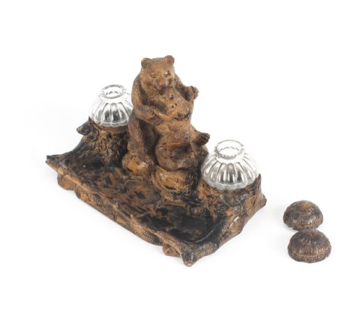 fig 6. A 19th-century carved wood Black Forest inkstand featuring a mother bear and cub sitting on a naturalistic log base between two clear glass inkwells.