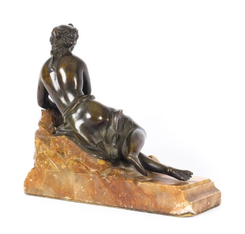 fig 2. A pair of 19th-century dark bronze sculptures depicting semi-nude classical reclining female figures set upon carved yellow marble bases.