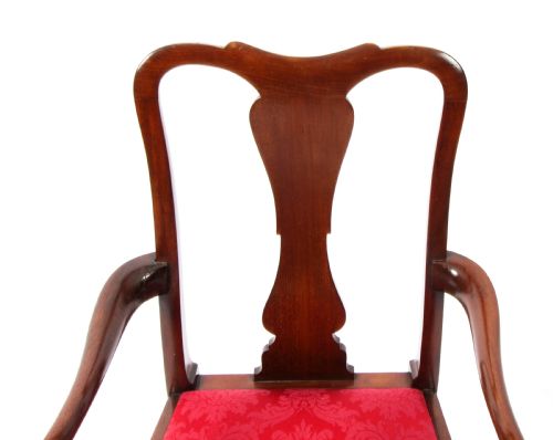 fig 2. A small dark mahogany Queen Anne style armchair with a vasiform back splat, curved arms, cabriole front legs, and a red damask upholstered seat.