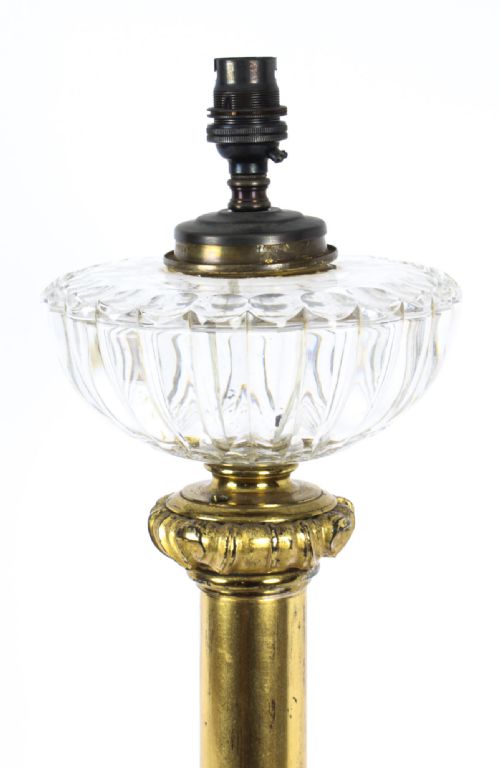 fig 4. An antique William IV gilt bronze table lamp featuring a column base with carved acanthus foliage and a cut glass bowl below the fitting.