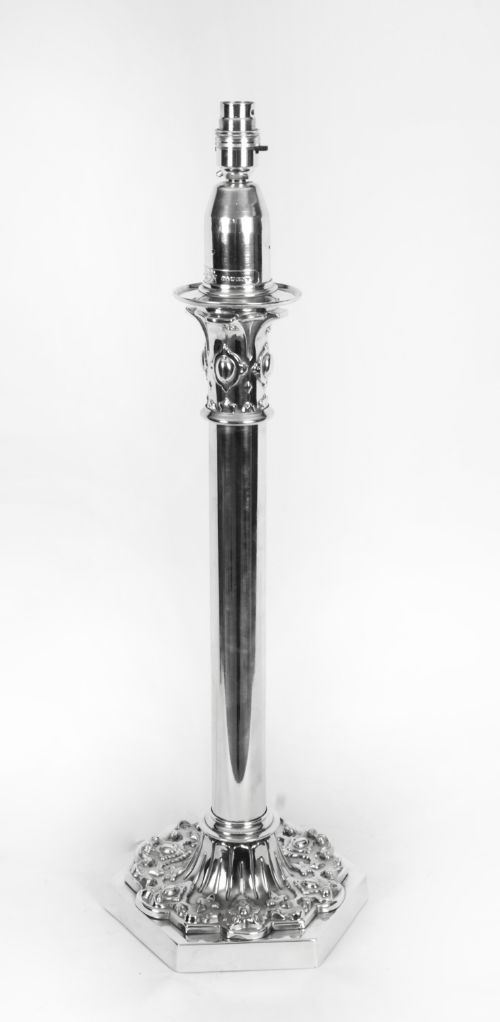 fig 1. A nineteenth-century silver-plated table lamp base featuring a cylindrical column stem set upon an intricately moulded hexagonal base.
