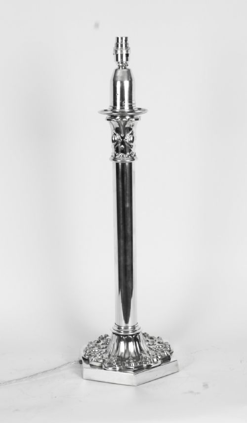 fig 2. A nineteenth-century silver-plated table lamp base featuring a cylindrical column stem set upon an intricately moulded hexagonal base.