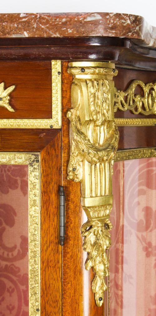 fig 3. A 19th-century French Vernis Martin glass display cabinet with painted lower panels, gilt-bronze mounts, cabriole legs, and a shaped marble top.