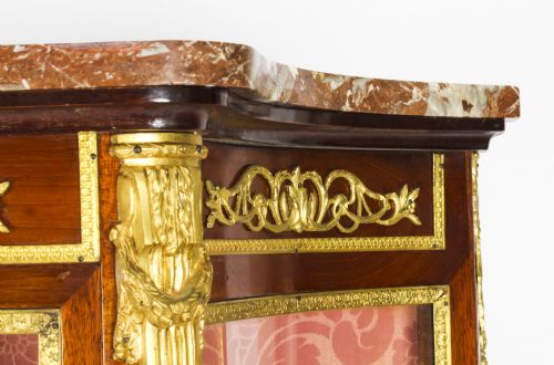 fig 4. A 19th-century French Vernis Martin glass display cabinet with painted lower panels, gilt-bronze mounts, cabriole legs, and a shaped marble top.