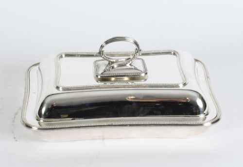 fig 1. A rectangular antique silver-plated entree dish featuring a fitted lid with a loop handle and fine beaded border details.