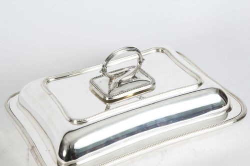fig 2. A rectangular antique silver-plated entree dish featuring a fitted lid with a loop handle and fine beaded border details.
