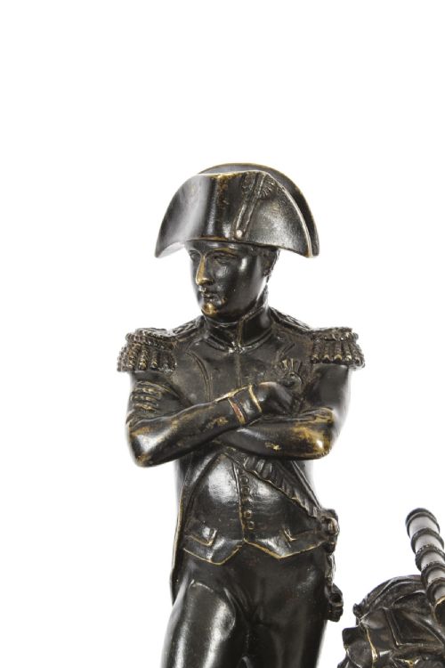 fig 2. A nineteenth-century dark patinated bronze statuette depicting Napoleon Bonaparte in military attire standing upon a rectangular bronze plinth.