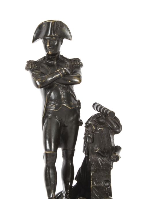 fig 4. A nineteenth-century dark patinated bronze statuette depicting Napoleon Bonaparte in military attire standing upon a rectangular bronze plinth.