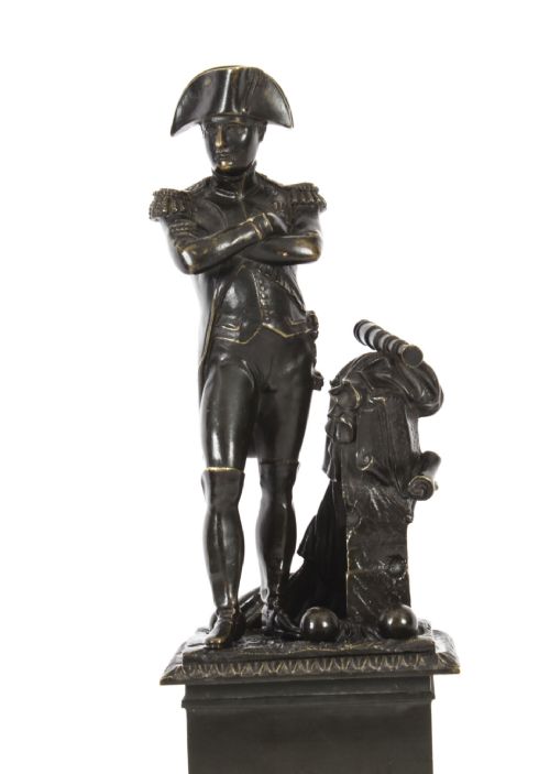 fig 5. A nineteenth-century dark patinated bronze statuette depicting Napoleon Bonaparte in military attire standing upon a rectangular bronze plinth.
