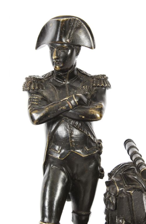 fig 6. A nineteenth-century dark patinated bronze statuette depicting Napoleon Bonaparte in military attire standing upon a rectangular bronze plinth.