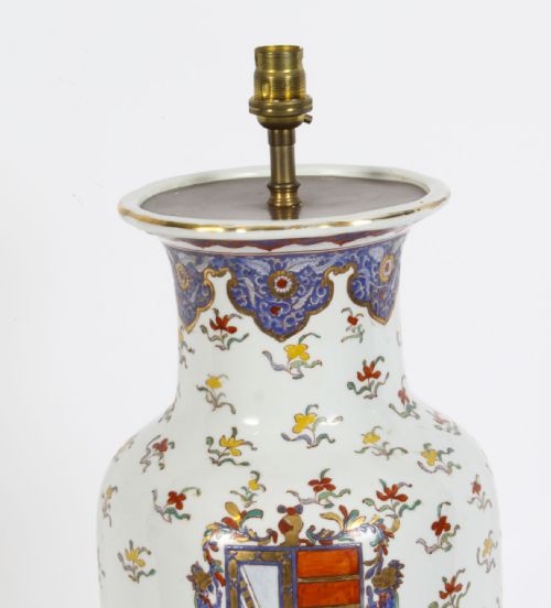 fig 1. A 19th-century French Samson porcelain table lamp featuring a hand-painted heraldic crest, floral sprigs, and gilt mounts.