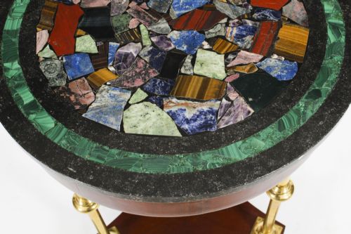 fig 2. A circular early 20th-century Italian occasional table featuring a colourful pietra dura inlaid stone top supported by three brass columns on a mahogany triform base.
