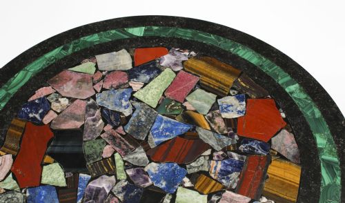 fig 5. A circular early 20th-century Italian occasional table featuring a colourful pietra dura inlaid stone top supported by three brass columns on a mahogany triform base.