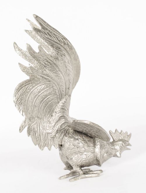 fig 5. A pair of silver-plated fighting cockerels facing each other in dynamic poses with detailed plumage.