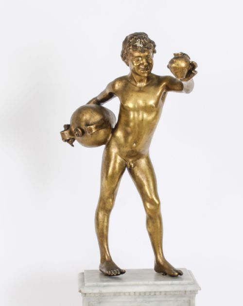 fig 2. A 19th-century bronze sculpture depicting a standing youth holding water vessels, mounted on a carved white marble fountain-style base.