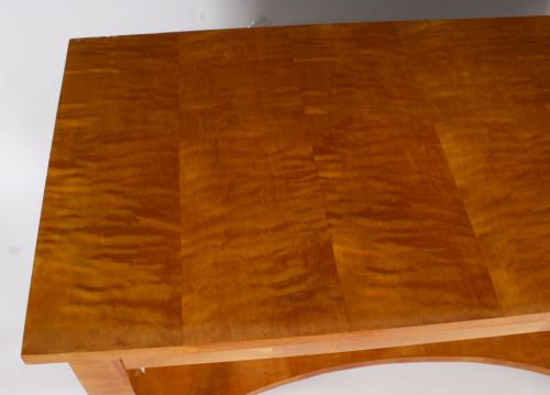 fig 3. A 19th-century Biedermeier console table featuring figured maserbirch veneer, a mirrored back panel, curved front legs with ebonised feet, and a concave lower shelf.