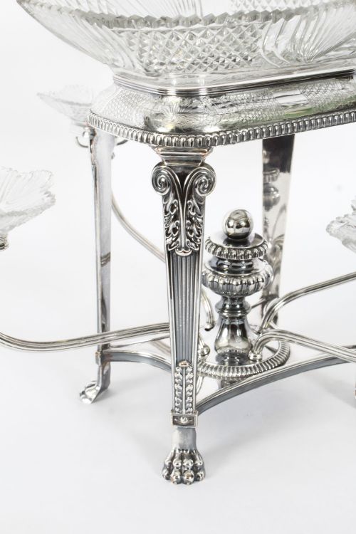 fig 1. An early nineteenth-century Old Sheffield plate and cut glass epergne centrepiece featuring four branching arms holding smaller crystal dishes beneath a large central glass bowl.