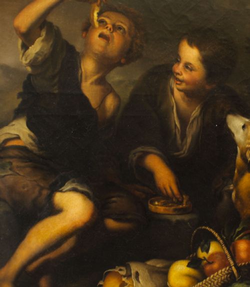 fig 3. An 18th-century oil painting depicting two boys with a dog and fruit, housed within a gilded frame with a scrolled top crest.