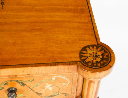 fig 8. A pair of 19th-century Adam Revival satinwood side cabinets featuring hand-painted classical swags, musical trophies, and slender turned legs.