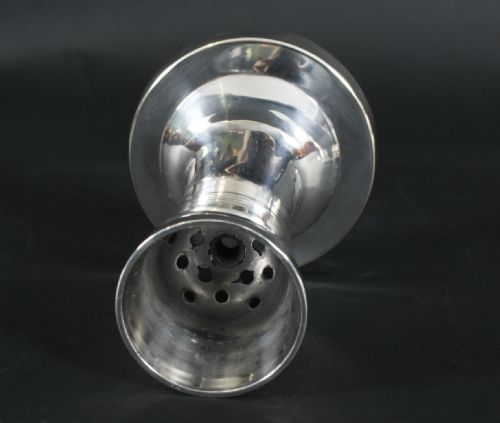fig 4. A silver-plated Art Deco cocktail shaker shaped like a handbell with a polished metal finish.