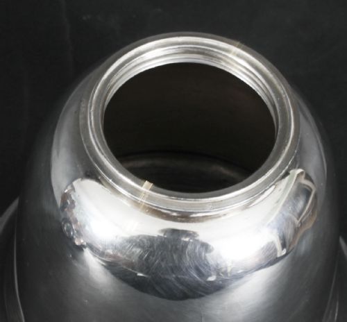 fig 6. A silver-plated Art Deco cocktail shaker shaped like a handbell with a polished metal finish.