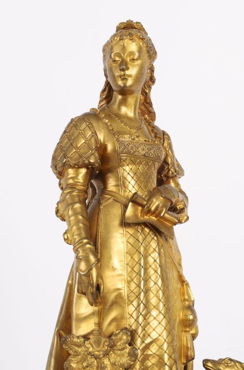 fig 2. A nineteenth-century gilt bronze sculpture depicting a noblewoman in a patterned gown holding a fan, standing next to a hound on a marble base.