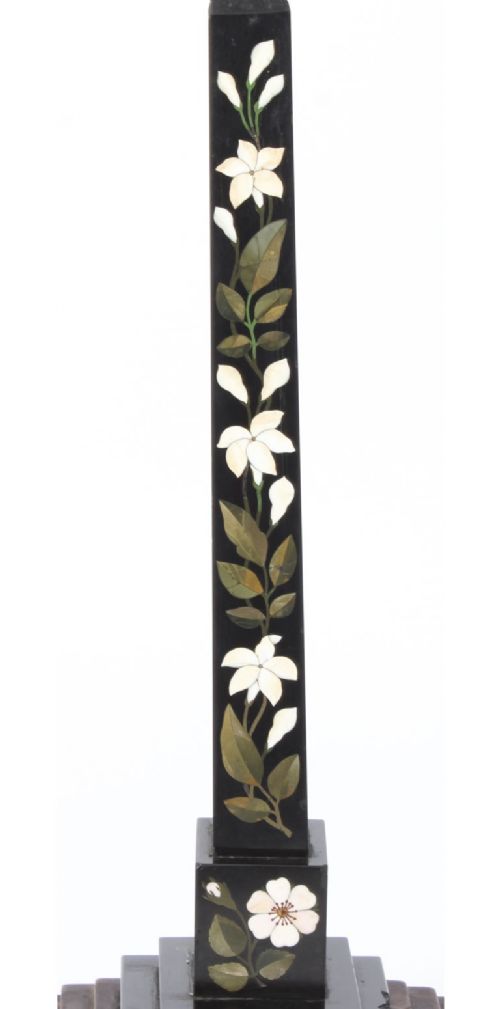 fig 3. A nineteenth-century Victorian black marble obelisk featuring floral pietra dura stone inlay, set upon a stepped square wooden base.