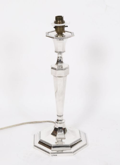 fig 1. An antique George V Art Deco sterling silver table lamp featuring a faceted octagonal column and stepped base.