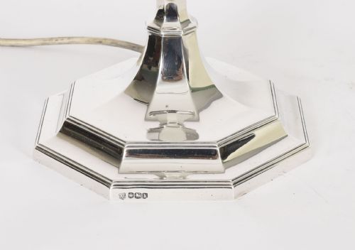 fig 4. An antique George V Art Deco sterling silver table lamp featuring a faceted octagonal column and stepped base.