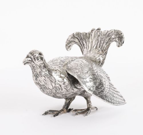 fig 2. A pair of 19th-century silver game bird figurines depicting grouse with detailed chased feather texturing.