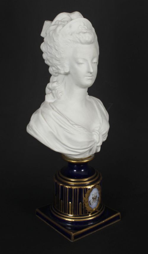 fig 2. A 19th-century white bisque porcelain bust of Marie Antoinette on a cobalt blue and gilded glazed pedestal.
