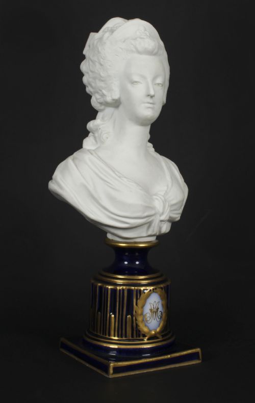 fig 4. A 19th-century white bisque porcelain bust of Marie Antoinette on a cobalt blue and gilded glazed pedestal.