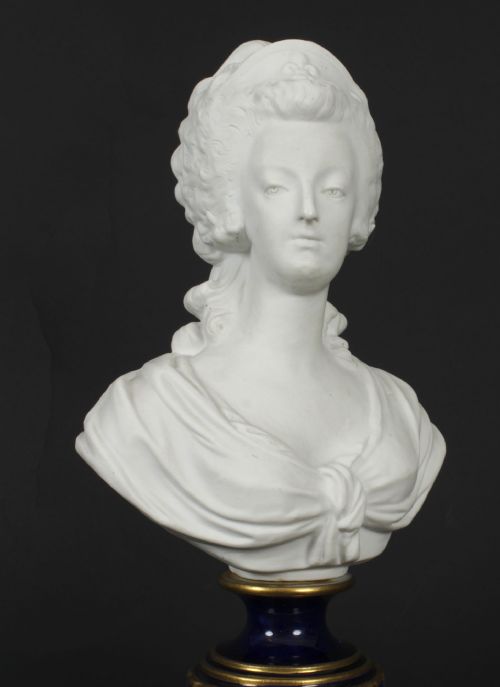 fig 5. A 19th-century white bisque porcelain bust of Marie Antoinette on a cobalt blue and gilded glazed pedestal.