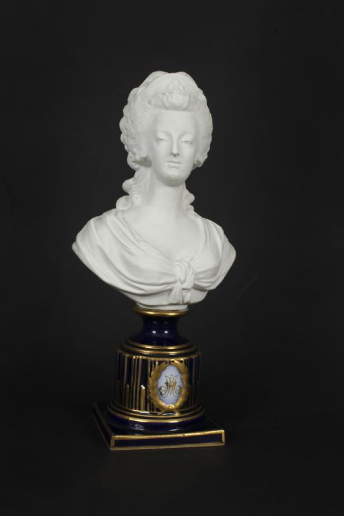 fig 6. A 19th-century white bisque porcelain bust of Marie Antoinette on a cobalt blue and gilded glazed pedestal.