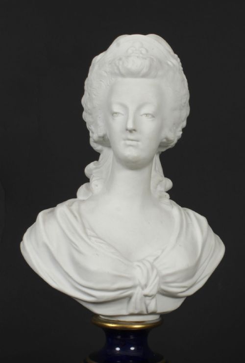 fig 7. A 19th-century white bisque porcelain bust of Marie Antoinette on a cobalt blue and gilded glazed pedestal.
