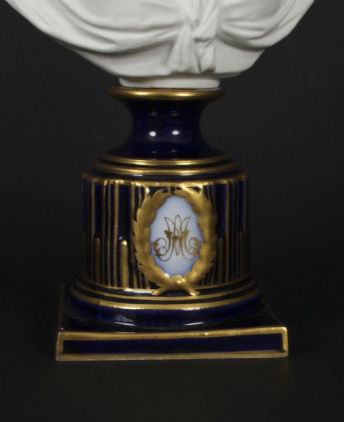 fig 8. A 19th-century white bisque porcelain bust of Marie Antoinette on a cobalt blue and gilded glazed pedestal.