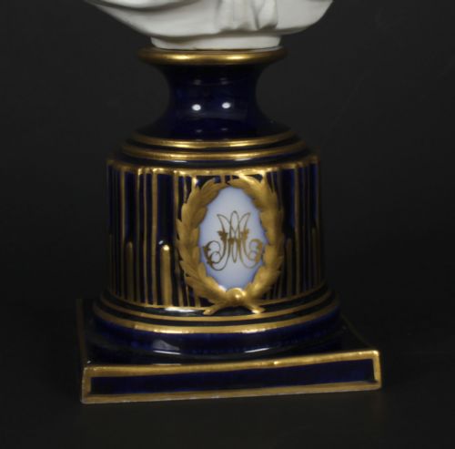 fig 9. A 19th-century white bisque porcelain bust of Marie Antoinette on a cobalt blue and gilded glazed pedestal.