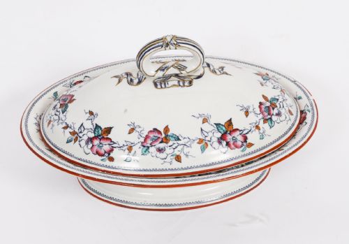 fig 1. A twenty-two piece antique Muller Volkstedt porcelain dinner service featuring white ground with floral borders, red rims, gold accents, including a large tureen, serving platters, and plates.