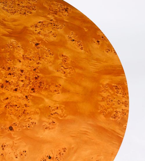 fig 3. A circular 20th-century Biedermeier revival coffee table made from burr elm with three column legs set on a triform plinth base.