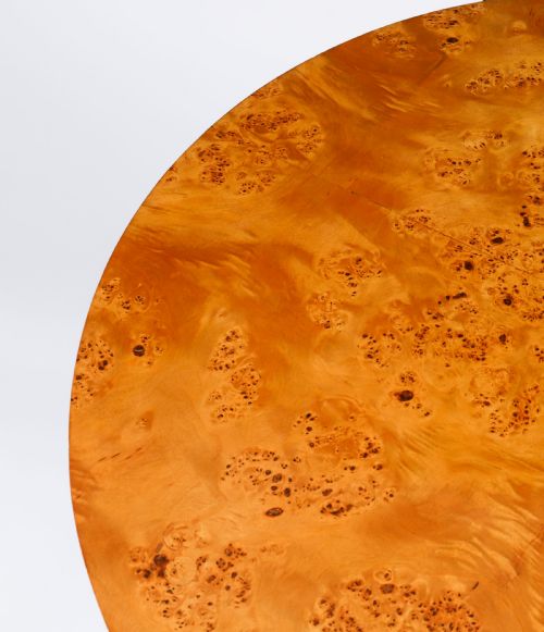 fig 4. A circular 20th-century Biedermeier revival coffee table made from burr elm with three column legs set on a triform plinth base.