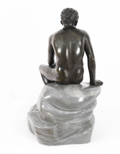 fig 7. A dark patinated bronze sculpture depicting a nude seated Hermes resting on a carved grey marble base.