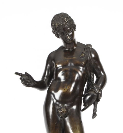 fig 7. A nineteenth-century dark patinated bronze statue of a classical nude youth standing in contrapposto on a circular veined marble pedestal base.